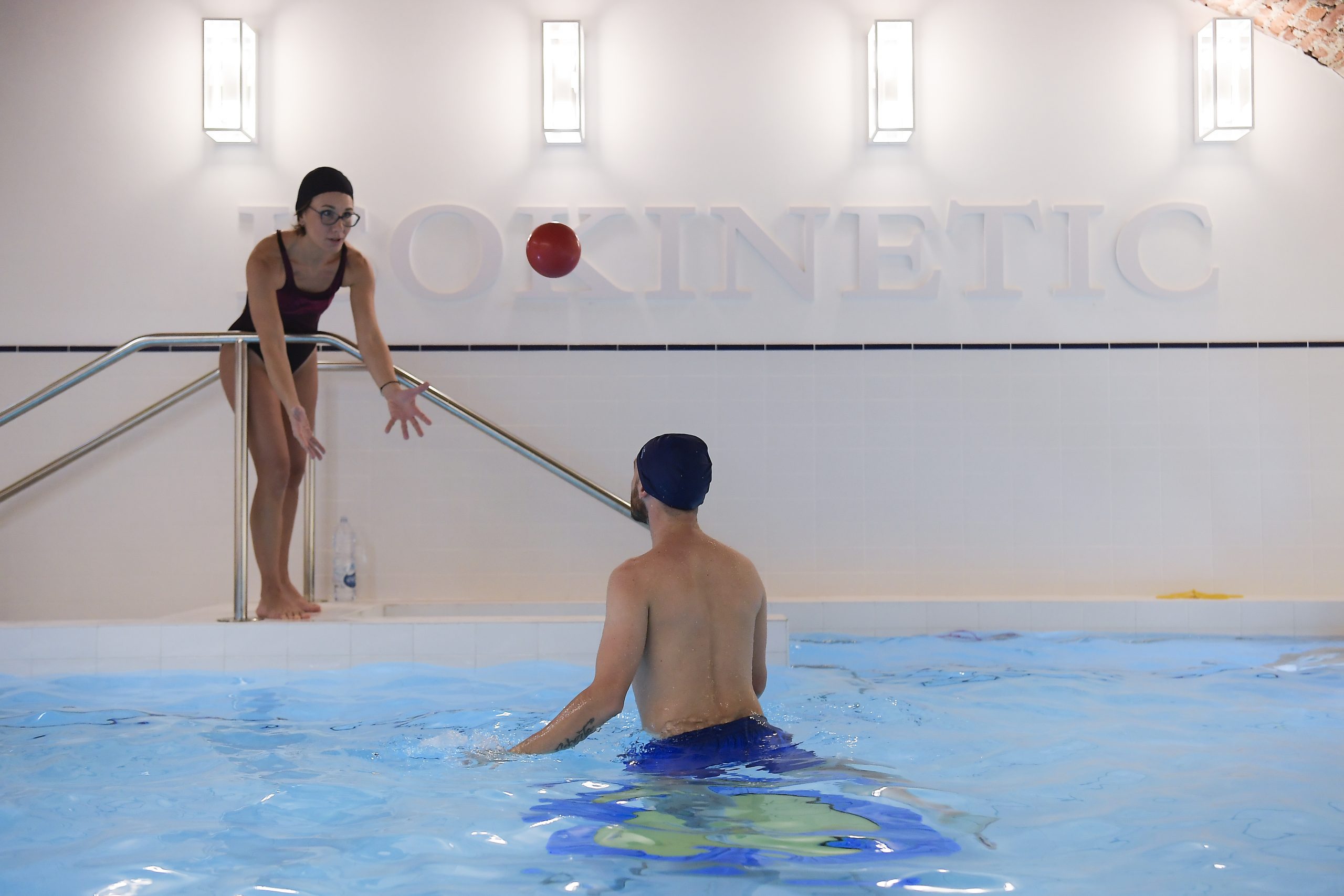 physiotherapist and patient in water doing mobilization exercise